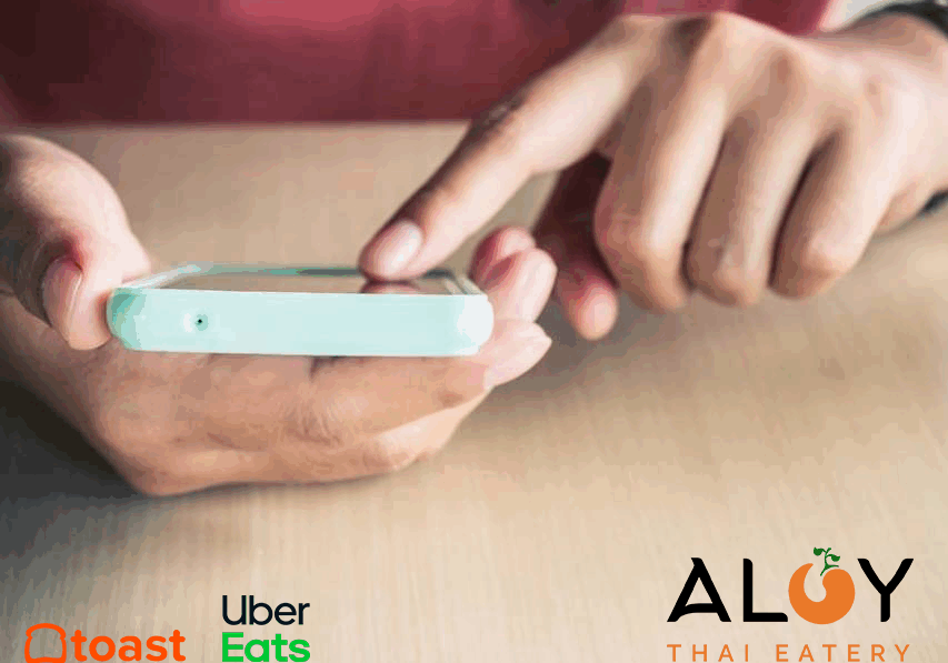 person on phone ordering from toast and uber eats